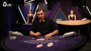 Multiple camera angles in hoki138 slot Dragon Tiger studio showing dealer, cards and gaming table